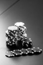 Vertical grayscale shot of stacks of poker chips Royalty Free Stock Photo