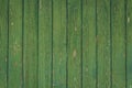 Vertical green vintage weathered textured paint chipped wood panel wall for background texture in any abstract scene Royalty Free Stock Photo