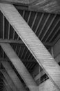 Vertical greyscale shot of an old attic with wooden ceiling Royalty Free Stock Photo