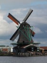 Vertical of the Het Jonge Schaap wooden mill by the Zaan river in the Netherlands Royalty Free Stock Photo