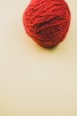 Vertical high angle shot of a ball of red yarn Royalty Free Stock Photo