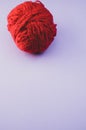 Vertical high angle shot of a ball of red yarn Royalty Free Stock Photo