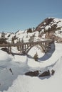 Vertical high angle shot of a bridge in the snowy Donner Summit Mountain pass in California