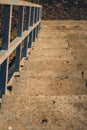 Vertical high angle shot of an old stairway with rusty handrailings