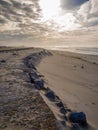 Vertical high angle shot of the sandy ground under the cloudy sky Royalty Free Stock Photo