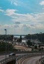 Vertical high-angle of view from the bridge to the cars, river and city