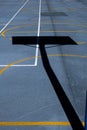 Vertical high-angle view of lines and shadows on a basketball playground under the sunlight Royalty Free Stock Photo
