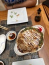Vertical high-angle view of Okonomiyaki - a Japanese savory pancake dish Royalty Free Stock Photo