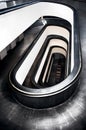 Vertical high-angle of white and black modern architecture stairs in Vatican Museums