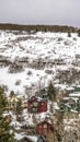 Vertical Homes built on a mountain blanketed with snow during winter season