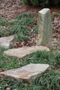 Vertical and horizontal stones among dwarf mondo grass Royalty Free Stock Photo