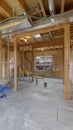 Vertical House interior under construction with air conditioning ducts on the ceiling