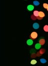 Vertical Image of Abstract Blurred Colorful Illuminated Decorating Light on Black Background