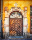 Vertical image of a beautiful ornate wooden door found in the Gamla stan area of Stockholm Royalty Free Stock Photo