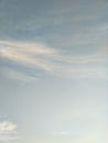 Vertical image of blue sky and white clouds on daytime. Royalty Free Stock Photo