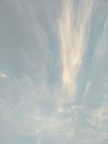 Vertical image of blue sky and white clouds on daytime. Royalty Free Stock Photo