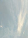 Vertical image of blue sky and white clouds on daytime. Royalty Free Stock Photo