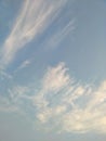 Vertical image of blue sky and white clouds on daytime. Royalty Free Stock Photo