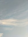 Vertical image of blue sky and white clouds on daytime. Royalty Free Stock Photo