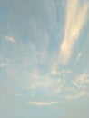 Vertical image of blue sky and white clouds on daytime. Royalty Free Stock Photo