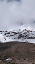 Vertical image of Cars parked at the bottom of Chimborazo Volcano, Ecuador Royalty Free Stock Photo