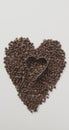 Vertical image of chocolate chips forming heart with heart shaped cookie cutter on white background Royalty Free Stock Photo