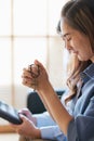 Vertical image. Close up woman holding the cross. Asian woman praying for blessings to Jesus It is the confession of sins before