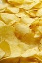 Vertical image.Closeup of tasty crispy potato chips as a background Royalty Free Stock Photo