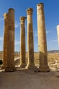 Vertical image of the corinthian columns of the Temple of Artemis in the background of the blue sky