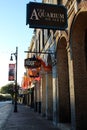 Line of storefronts and signs announcing each business, downtown Austin, Texas, 2018