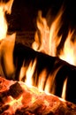 Vertical Image of Fire Log Burning Intensively Royalty Free Stock Photo
