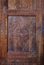 Vertical image of a fragment of a wooden front door in an old building