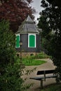 Vertical image of a garden pavilion surrounded by trees Royalty Free Stock Photo