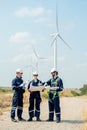 Vertical image of group of professional technician workers stand with discuss the project in the paper plan and stand in front of Royalty Free Stock Photo