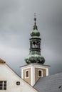 Vertical image of a grungy church steeple against a cloudy sky Royalty Free Stock Photo