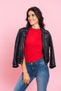 Vertical image of happy brunette woman posing and looking away