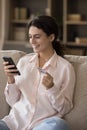 Vertical image joyful young woman buying goods online.