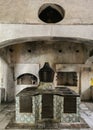 Vertical image of a kitchen with old equipments for cooking in Certosa di Padula, Campania, Italy
