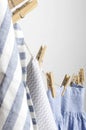 Vertical image.Laundry drying on the rope and hanging with wooden pegs