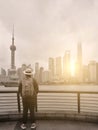 Vertical image of a man traveler with Shanghai city view Royalty Free Stock Photo