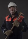 Mature miner covered in coal dust holding a pick axe Royalty Free Stock Photo