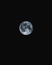 Vertical image of The Moon during night on a black background Royalty Free Stock Photo