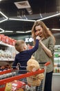 Vertical image of mother and son with candys