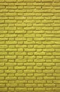 Vertical Image of Mustard Yellow Colored Brick Wall for Background Royalty Free Stock Photo