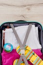 Vertical image of packed suitcase. Royalty Free Stock Photo