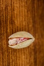 Vertical image Pistachio nuts a lot on wood macro Royalty Free Stock Photo