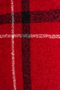 Vertical image of red checkered textured woolen background