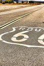 Vertical image of route 66 road leading towards the distant horizon Royalty Free Stock Photo