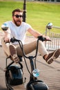 Vertical image of scared screaming bearded man in sunglasses