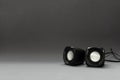 Pair of black speakers on the grey surface.Blank space Royalty Free Stock Photo